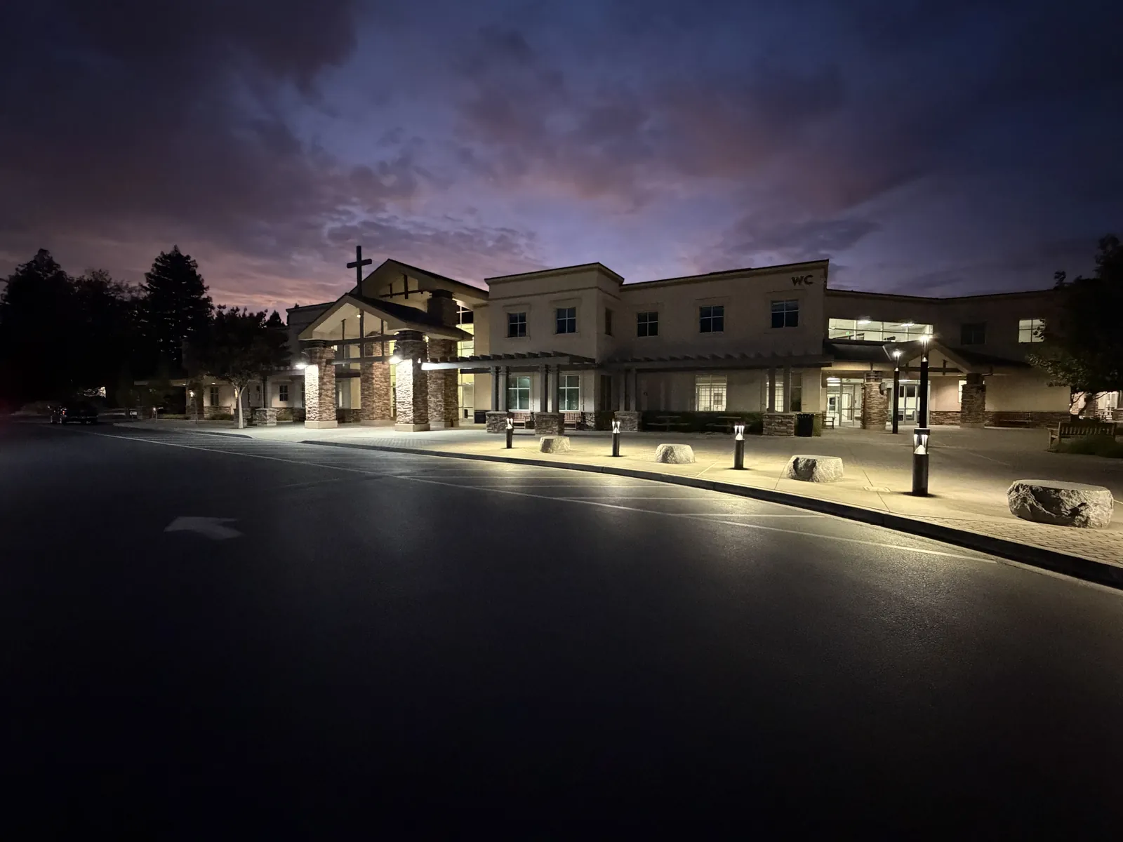 Campus walkways at dusk lit by new LED bollard lighting — North Creek Church, Walnut Creek